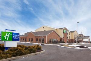 a building with a sign in a parking lot at Holiday Inn Express Hotel & Suites Cleveland-Streetsboro by IHG in Streetsboro