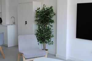 Telewizja i/lub zestaw kina domowego w obiekcie Panoramic Suite Beach