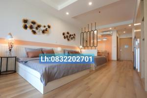 a bedroom with a large bed in a room at TMS Pullman Căn Hộ Cao Cấp Quy Nhơn in Quy Nhon