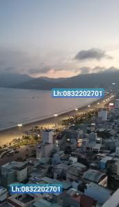 a view of a beach with buildings and the ocean at TMS Pullman Căn Hộ Cao Cấp Quy Nhơn in Quy Nhon