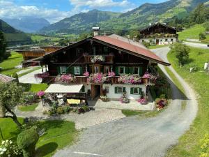 an aerial view of a house with flowers at Branderhof in Jochberg