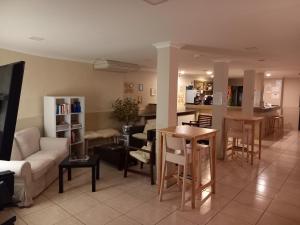 a living room with a couch and a table at Vilamar in Luz