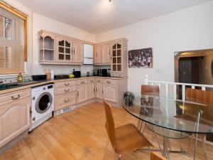 a kitchen with a glass table and a dining room at Pass the Keys Spacious 1 bed Flat Close to Central Location in Reading