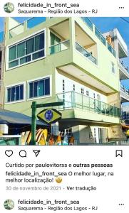 a post with a picture of a building at Felicidade in front sea in Saquarema
