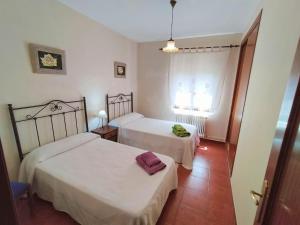 Ένα ή περισσότερα κρεβάτια σε δωμάτιο στο Casa Juanito