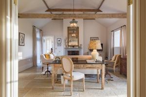 a dining room with a table and chairs at The Stables in Canterbury