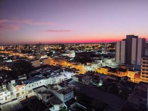 an aerial view of a city at night at Namaste in Paraná