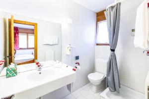 Koupelna v ubytování Hôtel Magrappé