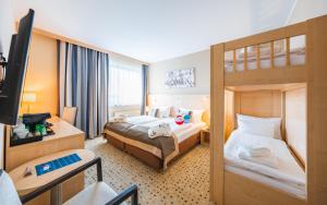 Postel nebo postele na pokoji v ubytování Aquapalace Hotel Prague