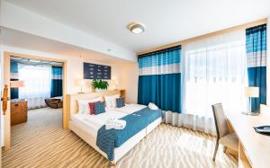 Postel nebo postele na pokoji v ubytování Aquapalace Hotel Prague