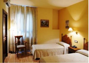 Cama o camas de una habitación en Hotel El Oasis