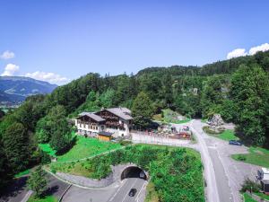 an aerial view of a house in the mountains at Hotel Pass Lueg in Golling an der Salzach