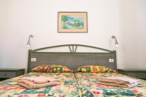 a bedroom with a bed with pillows on it at Westhaven Bay in Costa Del Silencio +41 photos