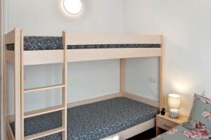 a bedroom with two bunk beds in a room at Casa Sole in Novate Mezzola