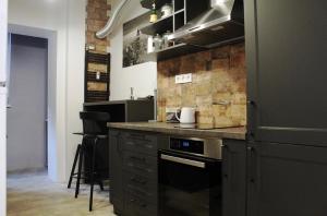 a kitchen with a stove and a counter top at Elegant apartment in the center of Sofia in Sofia