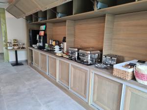 a kitchen with a counter with several appliances on it at New Wolf in Bran