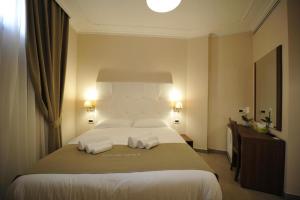 Ein Bett oder Betten in einem Zimmer der Unterkunft Villa Zaccardi
