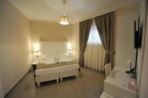 Ein Bett oder Betten in einem Zimmer der Unterkunft Villa Zaccardi