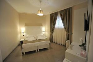 Een bed of bedden in een kamer bij Villa Zaccardi