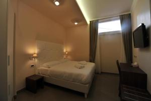 Ein Bett oder Betten in einem Zimmer der Unterkunft Villa Zaccardi