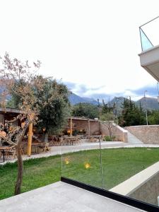 a view of a garden from a house at Le Rêve Boutique Hotel in Dhërmi