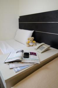 Letto o letti in una camera di Asphodel Inn