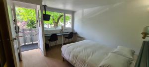 Postel nebo postele na pokoji v ubytování Kyriad Direct Nancy Sud -Vandoeuvre - Rénové