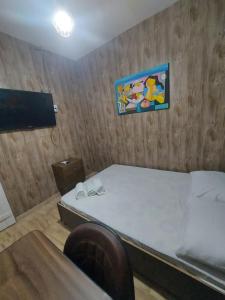 מיטה או מיטות בחדר ב-Casa de hospedagem Ferreira - Centro