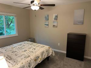 a bedroom with a bed and a ceiling fan at Carter #1 Two bedroom unit near Xavier Downtown in Cincinnati