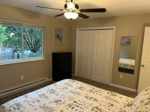 a bedroom with a bed and a ceiling fan at Carter #1 Two bedroom unit near Xavier Downtown in Cincinnati +10 photos