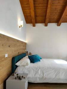 Säng eller sängar i ett rum på Casa Vacanze Al Molino
