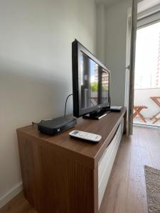 a television sitting on top of a wooden table at Amigi in Sarajevo