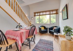 a dining room with a table and chairs at Bryn Triban in Llanddyfnan