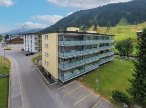 an apartment building in the middle of a street at Joe's Apartment am Bolgen in Davos