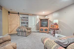 a living room with two couches and a tv at Lovely 3- bedroom apartment with street parking. in Goshen