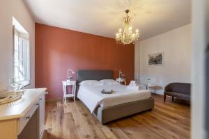 Un pat sau paturi într-o cameră la Ninfeo dell' Arancera