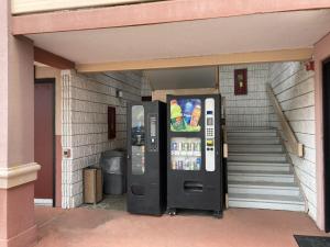 two vending machines sitting outside of a building at Red Roof Inn Virginia Beach-Norfolk Airport in Virginia Beach