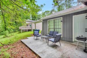 a patio with chairs and a table and a garage at Pleasant Stay Getaway in Atlanta