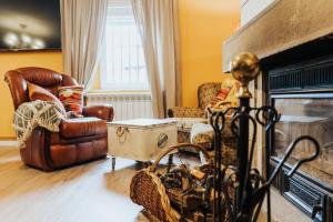 a living room with a couch and a fireplace at Casa Real 110+2 in Matamorosa