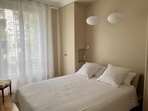 Posteľ alebo postele v izbe v ubytovaní La Villa d'Auteuil, Paris 16, rénovée
