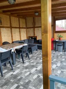 a room with a table and chairs in a building at Casa Alex in Constanţa