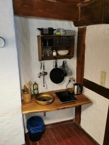 a small kitchen with a wooden counter in a room at Ferienwohnung Flurerturm in Beilngries +4 photos