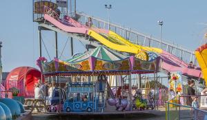 a carnival ride with a roller coaster at Hollie’s Hemsby holidays - static caravan in Hemsby