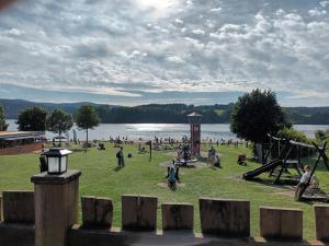 a group of people playing in a park at apartmán Sedmička Frymburk in Frymburk