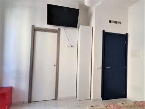 TV a/nebo společenská místnost v ubytování Affittacamere Casa Cynda