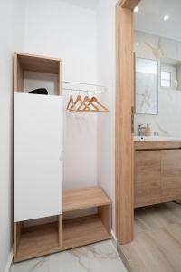 a bathroom with a sink and a mirror at Amalia in Matala