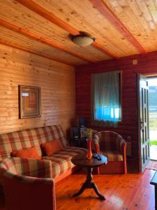 a living room with a couch and a table at Apartments Bulatovic in Žabljak