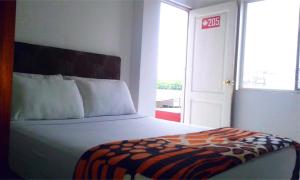 Postel nebo postele na pokoji v ubytování Bahia B&B