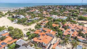 an aerial view of a beach and houses at Villa Paihia Jericoacoara in Jericoacoara