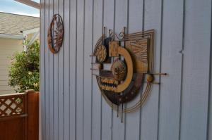 a clock on the side of a house at Dogwood Bed & Breakfast in Summerland